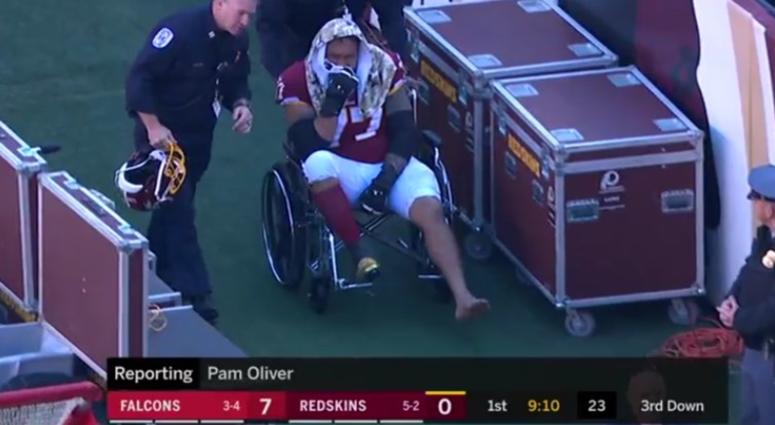 Trainers wheel Lauvao off the field in the first quarter against the Falcons Shawn_Lauvao_Wheelchair